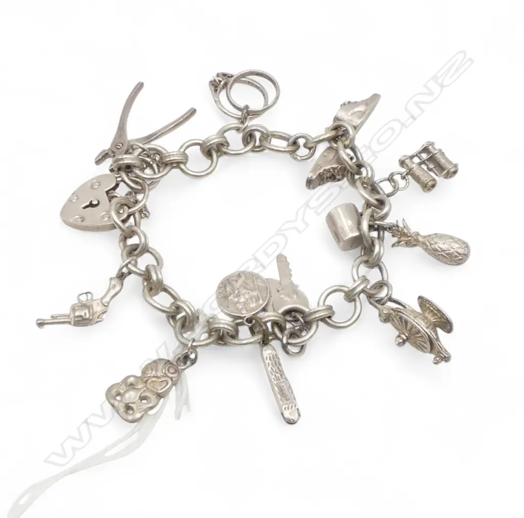 SILVER CHARM BRACELET tiki + pliers + other charms 47gms Image 1++