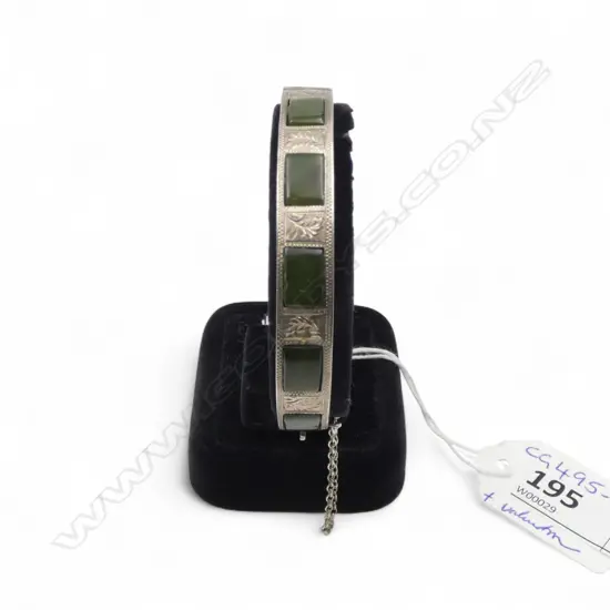 STERLING SILVER AND POUNAMU BANGLE with valuation