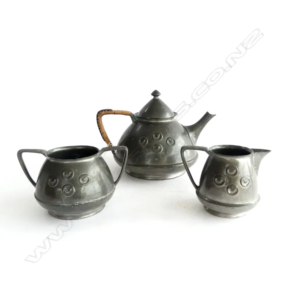'TUDRIC' PEWTER 3- PIECE ARTS & CRAFTS TEASET, POINTED w CANE WOVEN HANDLE, POT W.200mm Image 1++