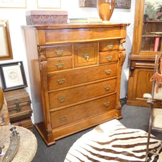 NINE DRAWER MOTTLED KAURI SCOTCH CHEST  SERPENTINE TOP FRIEZE DRAWER CARVED COLUMNS1205x570x1355mm feet need reattaching
