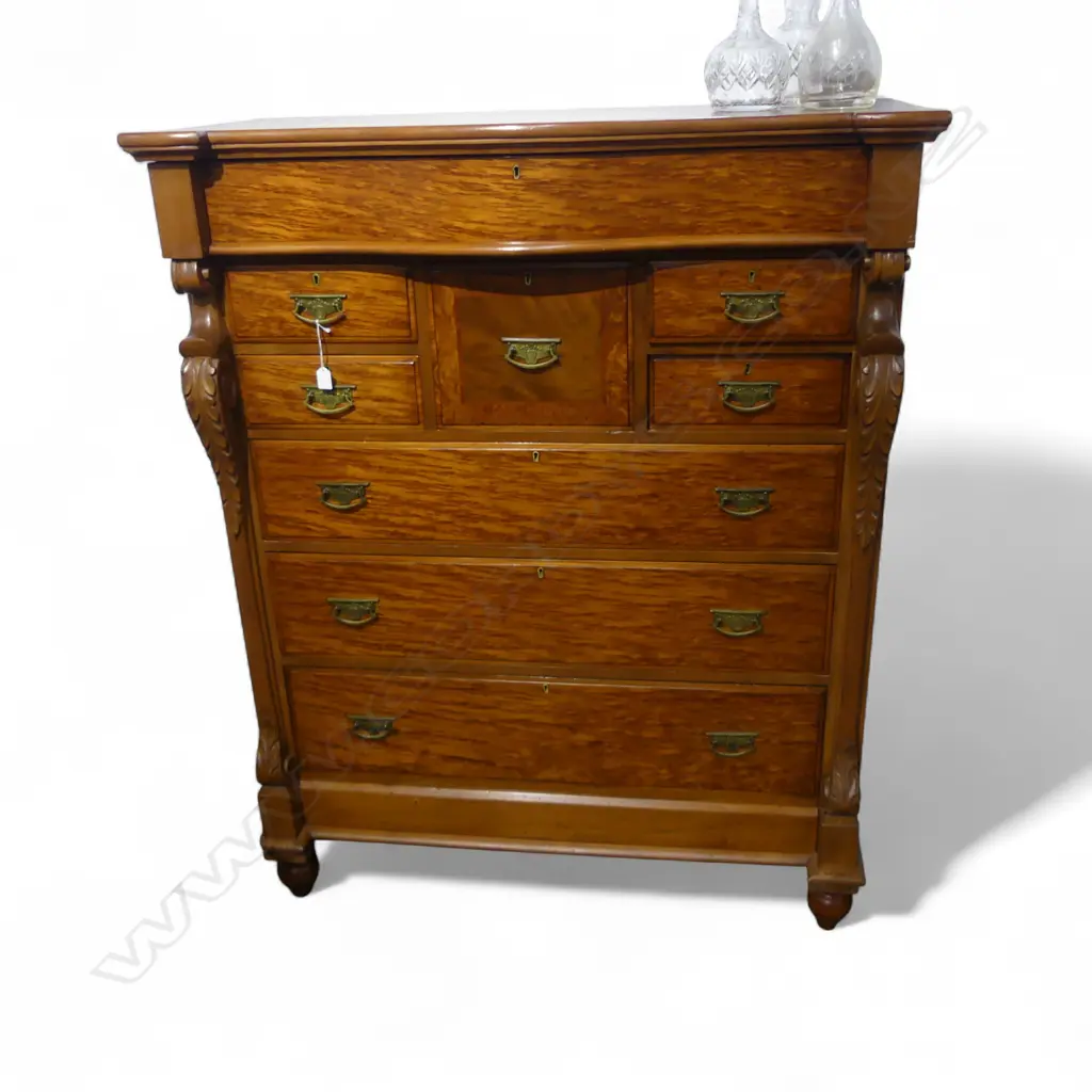 NINE DRAWER MOTTLED KAURI SERPENTINE TOP SCOTCH CHEST WITH FRIEZE DRAWER & CARVED COLUMNS  1210x570x1510mm Image 1++