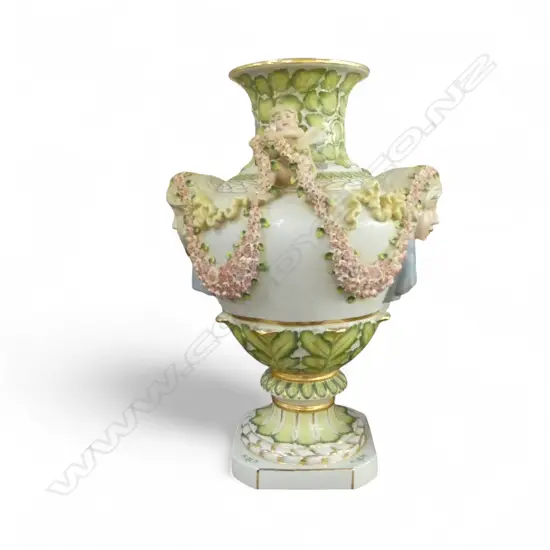 A DRESDEN STYLE VASE MODELLED IN THE 19TH CENTURY MANNER WITH PUTTI AND FLORAL SWAGS 535 mm (H)