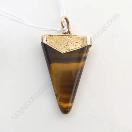 9ct ANTIQUE TIGERS EYE TOOTH SHAPE FOB (3cm long)