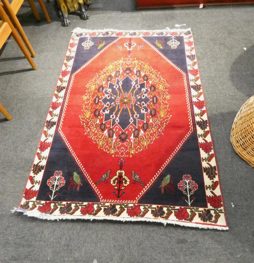 **RTV** PERSIAN QASHQAI WOOL PILE RUG; Central medallion on red ground w. bird motifs to each end 1450x1050mm Image 1++