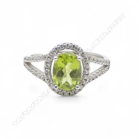 SILVER & PERIDOT RING, 1.3ct, adjustable size, AIG report 