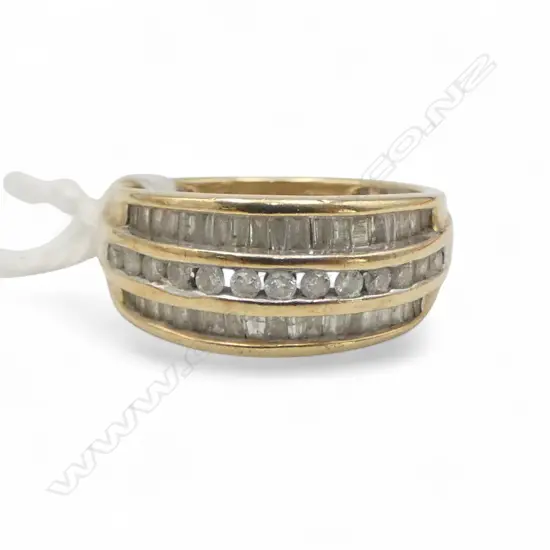 9ct  CHANNEL SET DIAMOND BAND, 3.71gm SIZE N