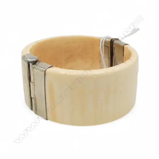Ivory bangle with white metal fittings