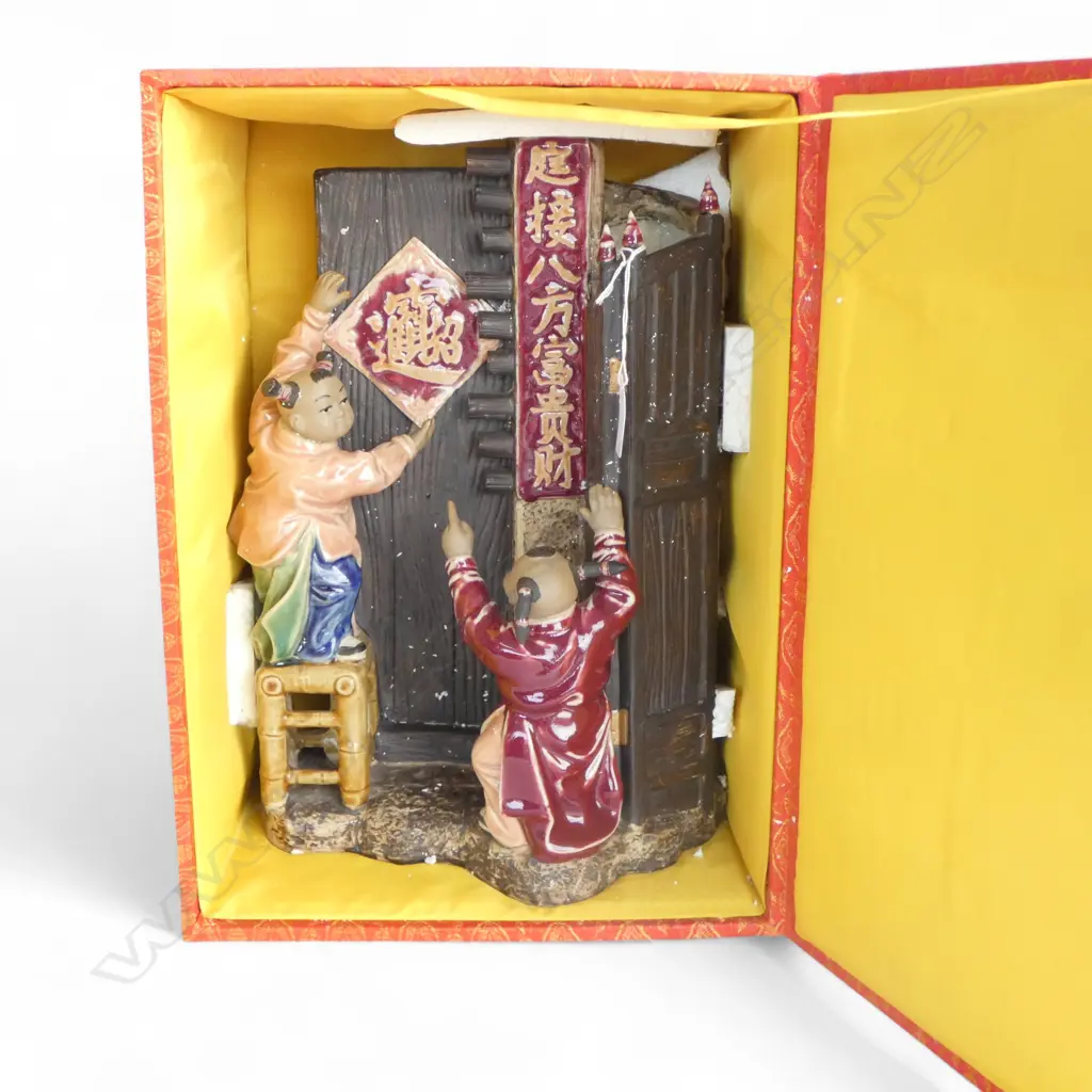 A CHINESE SHIWAN FIGURAL GROUP DEPICTING CHILDREN HANGING A FESTIVE DECORATION 350MM (h) with presentation box Image 1++
