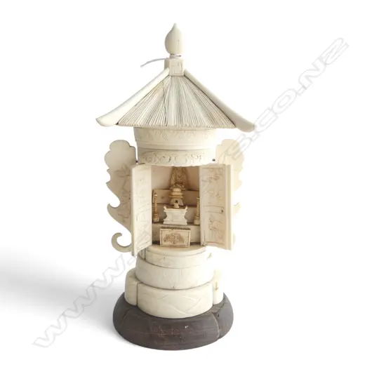 CARVED BONE JAPANESE SHRINE doors open to carved interior. One door w. fault. H.220mm