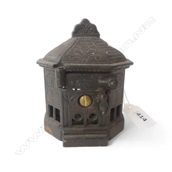 OLD CAST IRON MECHANICAL BANK 'SNAP IT' by H.L. JUDD. HEXAGONAL form. The sprung pull open door with latch. H.100mm