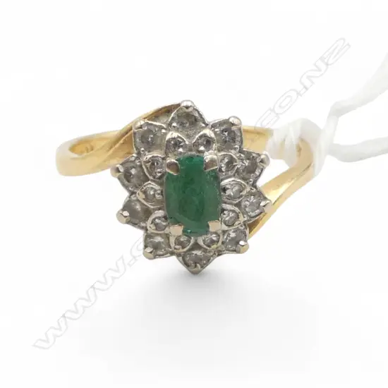 18CT GOLD EMERALD AND DIAMOND RING 4.65gms (Emerald has some damage) SIZE T