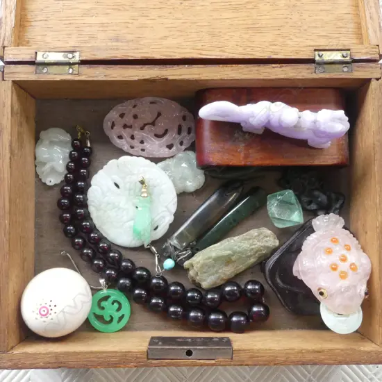 WOODEN JEWELLERY BOX W.215mm  ASST. CONTENTS ORIENTAL STONE CHARMS (0ne with 18ct top/pendent A/F to fingers)