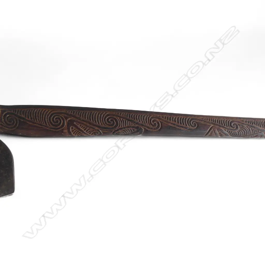 mid / late 20thC MAORI TOKI KAKAUROA  w 19thC TRADE AXE BLADE; CARVED 'TE UMUROA' TO THE SHAFT. L.905mm Image 1++