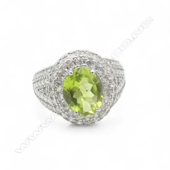 PERIDOT & CZ SILVER RING, AIG REPORT SIZE Q