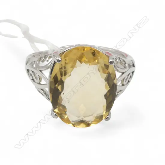 OVAL CITRINE & CZ RING, AIG REPORT SIZE AJUSTABLE