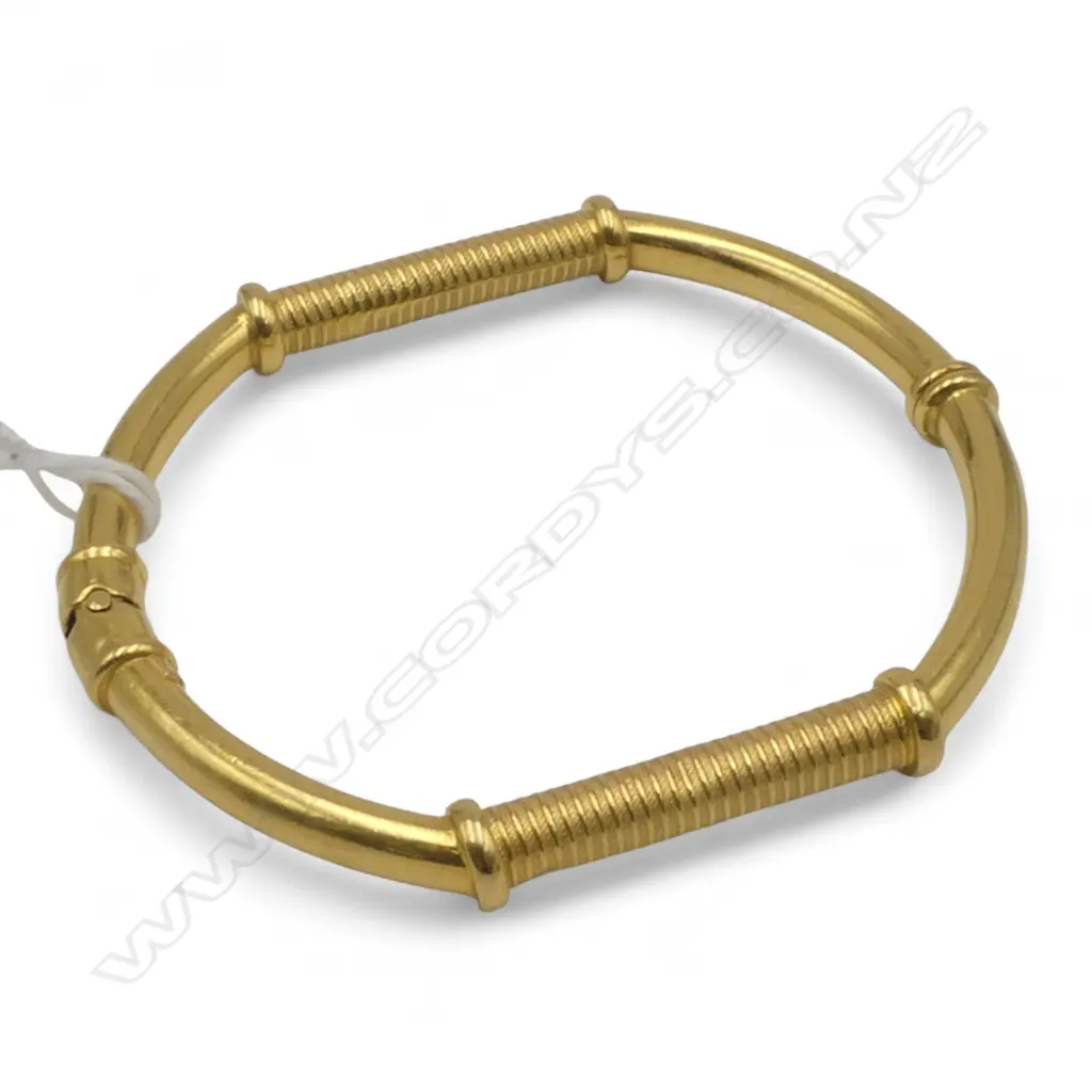 22CT GOLD BANGLE with small steel spring  21.92gms... Image 1++