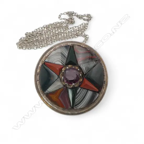 Early 20thC stg silver stone set shield form brooch with chain. Banded agates etc