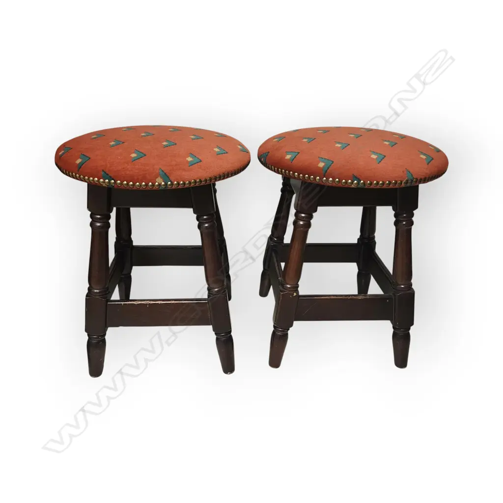 HEAVY PAIR OF VINTAGE WOODEN STOOLS – DARK WOOD WITH RED UPHOLSTERED SEATS AND STUDDED TRIM. Image 1++