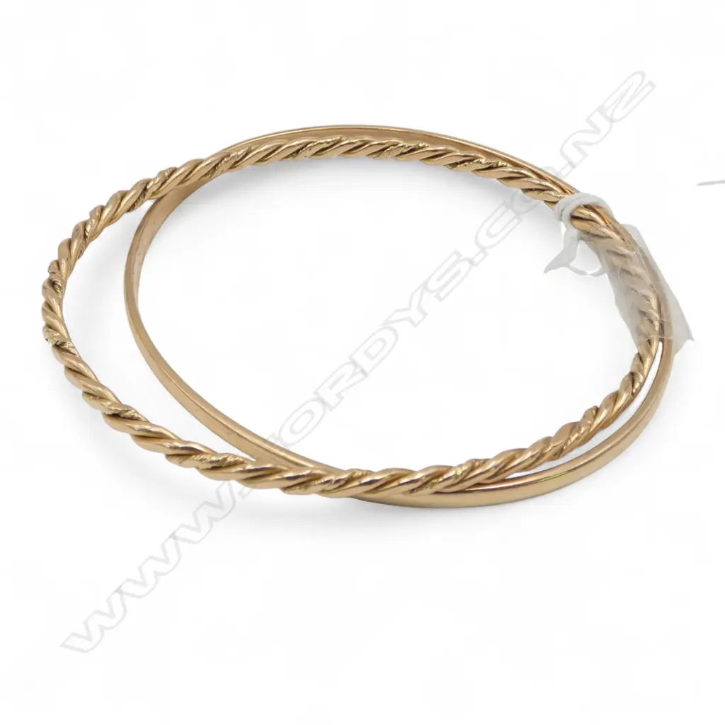 18ct gold twist bangle 17.34gms + 14ct gold plain hoop bangle 16gms. NOTE this description has changed Image 1++