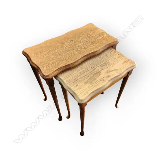 VINTAGE NESTING TABLES WITH CARVED LEGS AND A RUSTIC OAK FINISH