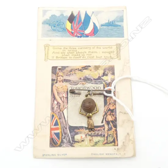 WWI ‘Touchwood’ Queen Alexandra lucky silver and wood charm with original printed card backing - minor insect damage