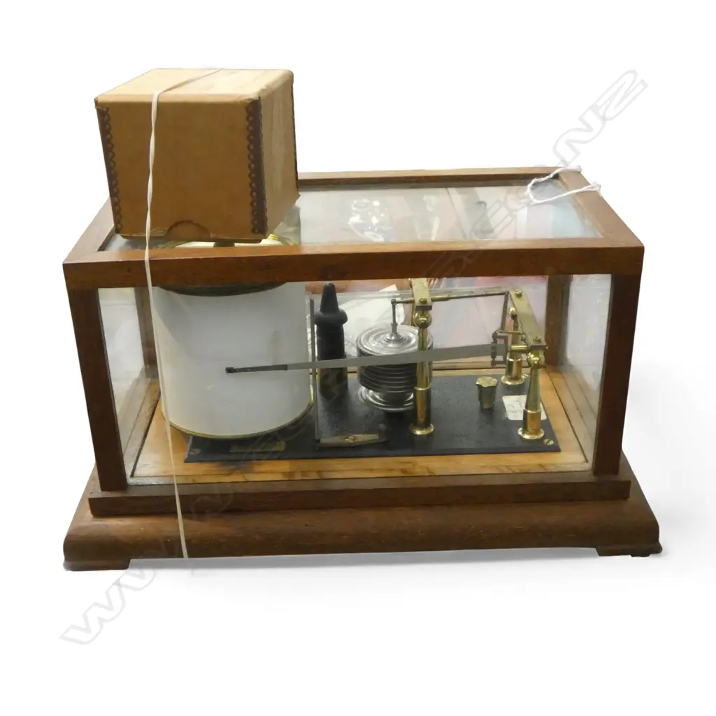 NEGRETTI & ZAMBRA LONDON mid 20thC OAK CASED BAROMETER w plaque '28/31 in.Hg  R/32068'. L.350mm. With ink in box Image 1++