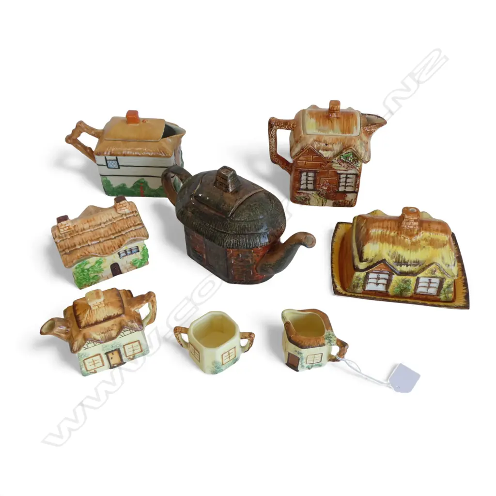 8 PCES COTTAGE WARE; 4 TEAPOTS, 2 LIDDED CONTAINERS, MILK JUG & SUGAR BOWL Image 1++