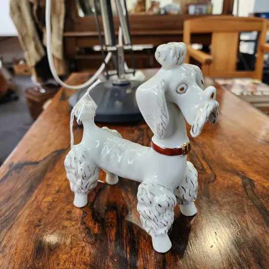 VINTAGE WHITE CERAMIC POODLE FIGURINE WITH GOLD ACCENTS AND A RED COLLAR