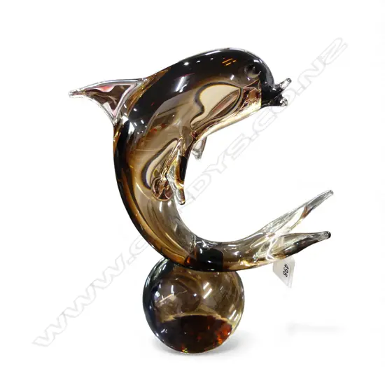 A SIGNED MURANO BROWN GLASS DOLPHIN BALANCING ON A BALL 265 x 200mm