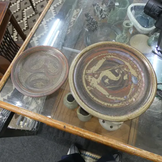 2 CREWENNA POTTERY PLATES (Harry & May Davis), wax resist tenmoku decoration, impressed potters mark, Dia.180 & 260mm