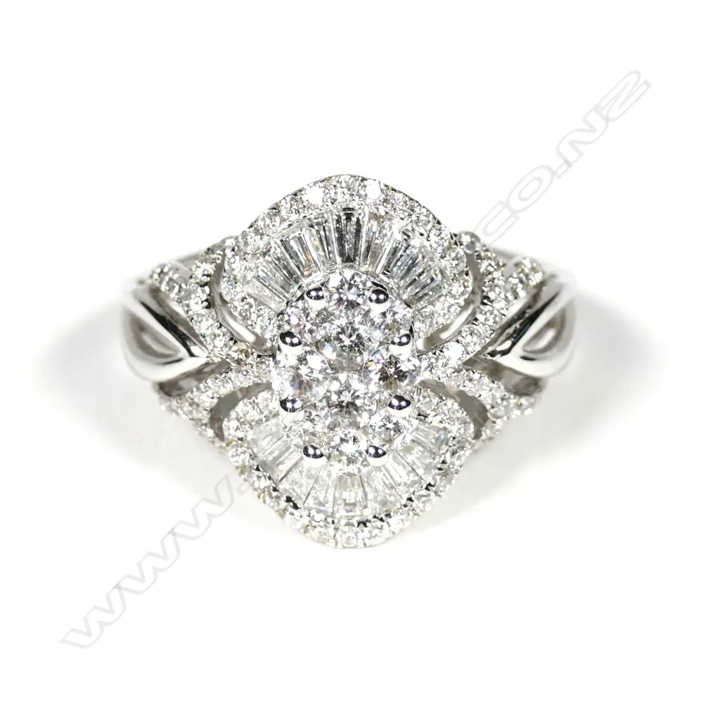 A modern 18ct white gold diamond cluster ring, Image 1++