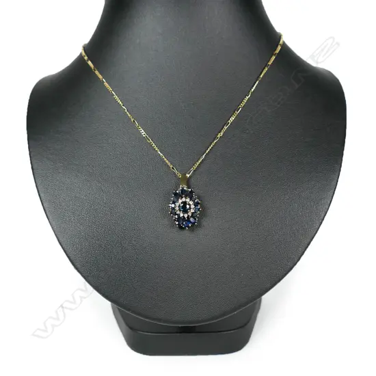 A 14ct gold and sapphire pendant,