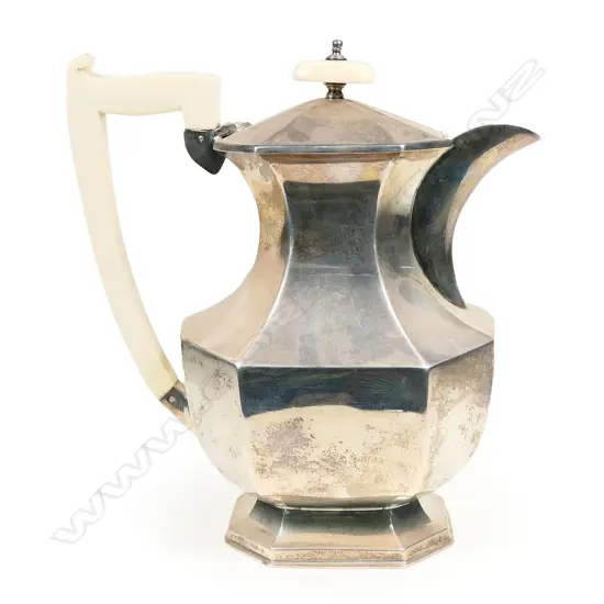 An Art Deco silver hot water pot with ivory handle and finial. Sheffield 1935 by Viners Ltd. 665gm