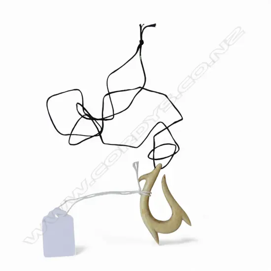 DAVID TUART CARVED WHALE BONE HEI MATAU pendant. L.58mm