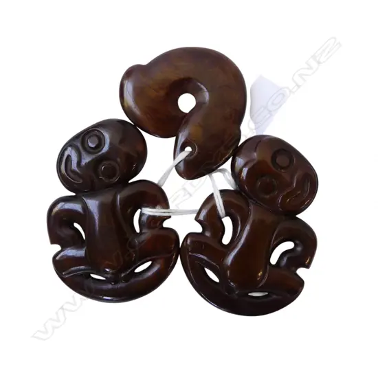 2 David Tuart hardwood carved hei tiki tiki and 1 hei matau. L's.60 & 43mm....