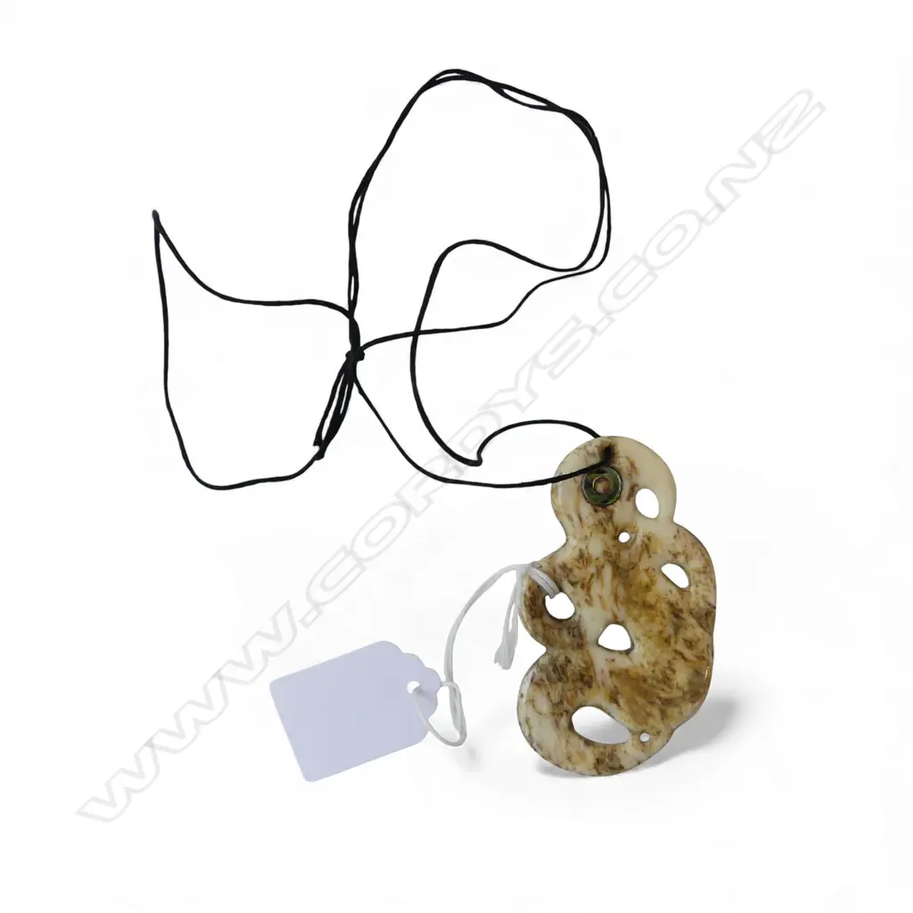 *RTV* DAVID TUART CARVED WHALE BONE HEI MARAKIHAU stylised figured pendant with paua rings to eyes. H.75mm Image 1++