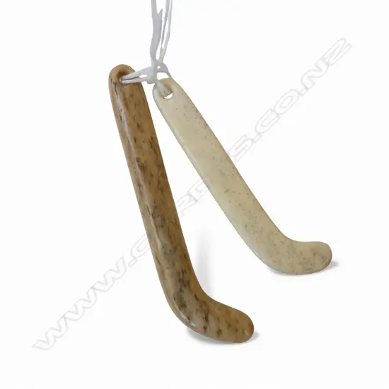 2 David Tuart carved whalebone Maori kapeu pendants. L.85 & 70mm.