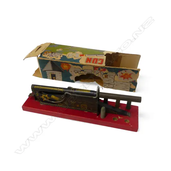 VINTAGE TINPLATE 'MODEL H.83 SEIGE GUN' on red painted wooden base L.33cm 6 bullets (2 missing) in original faulted box 