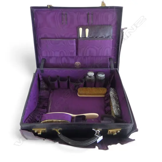 VINTAGE FINNIGANS VANITY TRAVEL CASE; 2 STG CAP BOTTLES, STG SILVER BRUSH, ASST. IVORY HANDLED PCES