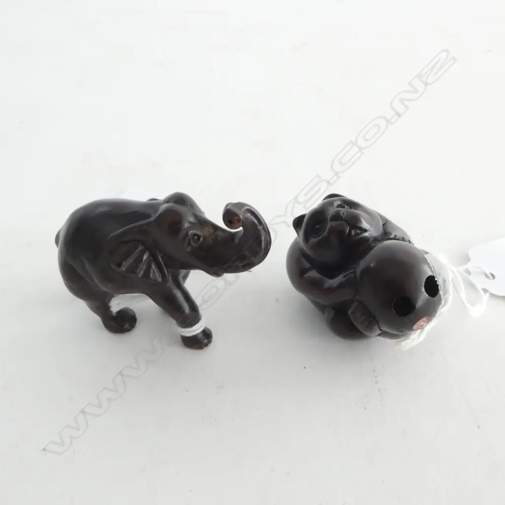 TWO ROSEWOOD NETSUKE; ELEPHANT & HONEYBEAR Image 1++