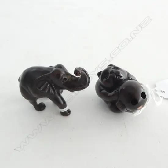TWO ROSEWOOD NETSUKE; ELEPHANT & HONEYBEAR