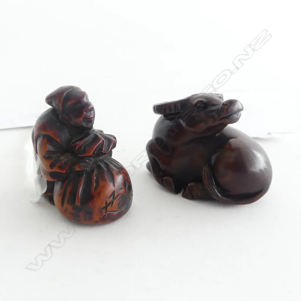 TWO CARVED WOOD NETSUKE; OLD MAN & BAG & WATER BUFFALO Image 1++