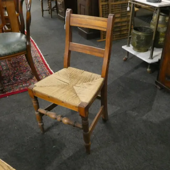 ANTIQUE WOODEN DINING CHAIR, WOVEN SEAT, BACK STRETCHER w. OLD BORER