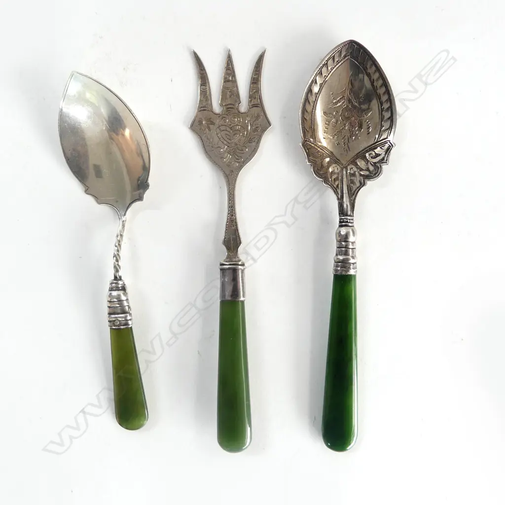 3 EARLY 20thC SILVER & POUNAMU PIECES: 2 preserve SPOONS + ORNATE FORK w Maori engraved face. Ea marked Sterling Image 1++