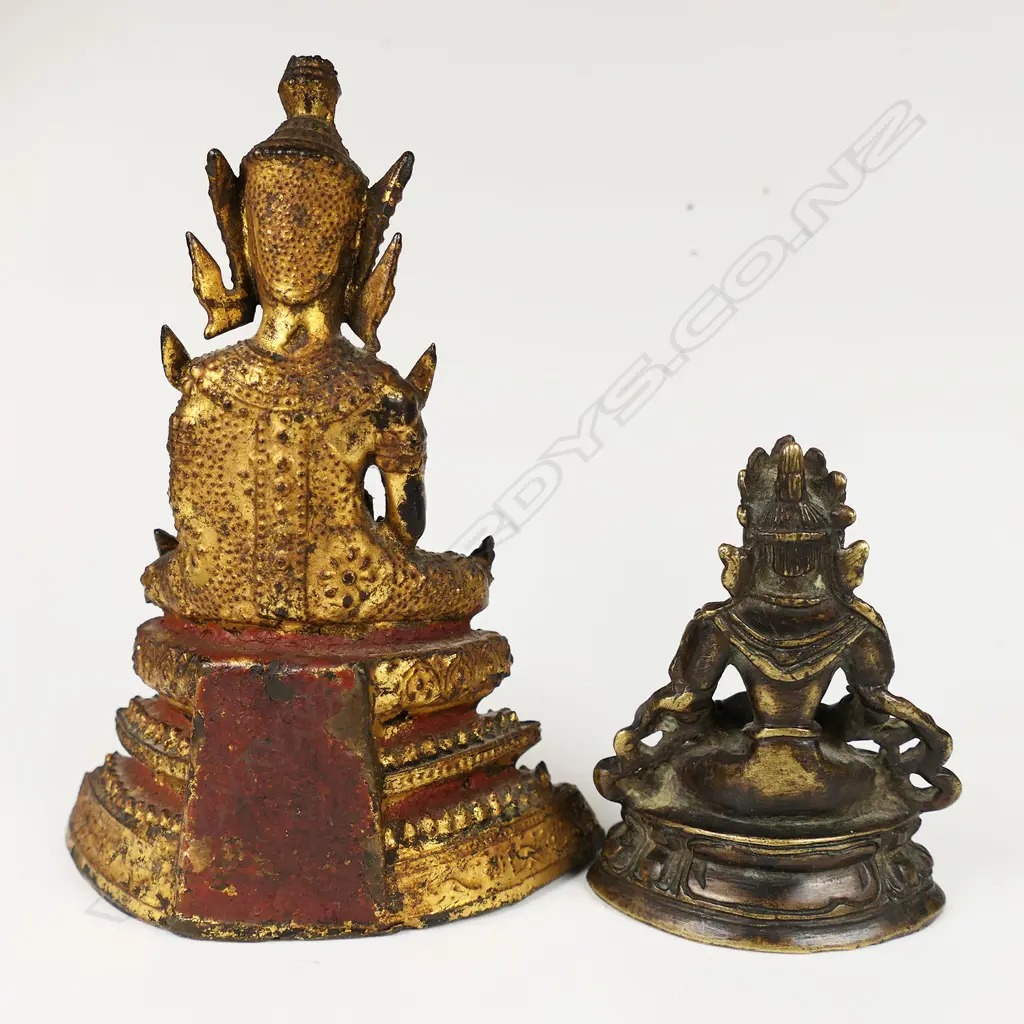 Two small buddhas; one early Rattanakosin period (18th-19thC) bronze with remnant gold leaf and red lacquer. H.110mm. The other (reputedly Ming period) bronze Sino-Tibetan - seated in dhyana mudra upon a double lotus throne. H.62mm. Provenance: The Jorgen Lotz Collection. Image 1++