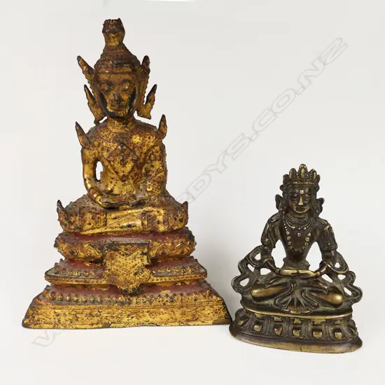 Two small buddhas; one early Rattanakosin period (18th-19thC) bronze with remnant gold leaf and red lacquer. H.110mm. The other (reputedly Ming period) bronze Sino-Tibetan - seated in dhyana mudra upon a double lotus throne. H.62mm. Provenance: The Jorgen Lotz Collection.