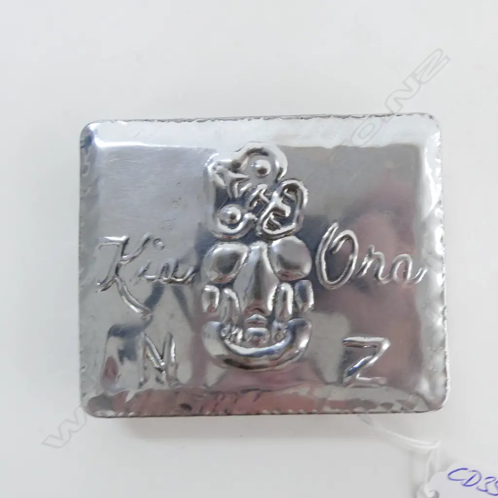VINTAGE TIN EMBOSSED WITH TIKI AND 'KIA ORA NZ' W.95mm Image 1++
