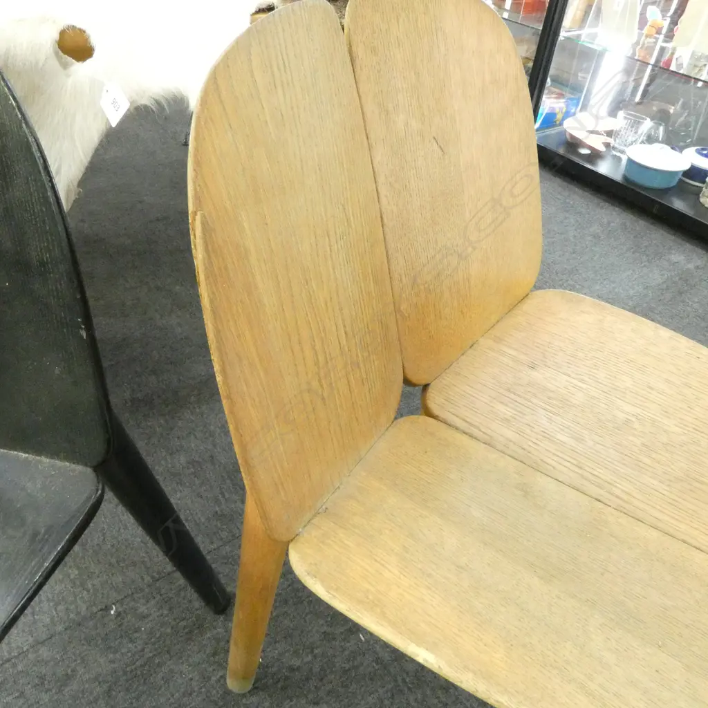 2 MC3 CHAIRS; *REPAIR NEEDED TO RIGHT SIDE OF NATURAL COLOURED CHAIR (see addit. photos)+ split in black chair. Image 1++