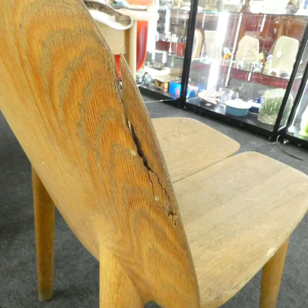 2 MC3 CHAIRS; *REPAIR NEEDED TO RIGHT SIDE OF NATURAL COLOURED CHAIR (see addit. photos)+ split in black chair. Image 1++