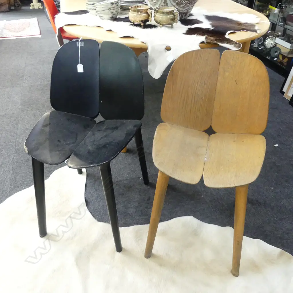 2 MC3 CHAIRS; *REPAIR NEEDED TO RIGHT SIDE OF NATURAL COLOURED CHAIR (see addit. photos)+ split in black chair. Image 1++